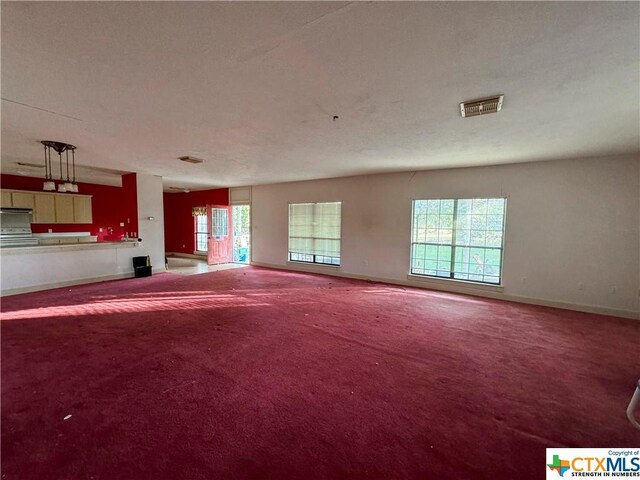 21 Anderson Ln, Coldspring, TX 77331 - unfurnished living room with carpet floors and baseboards