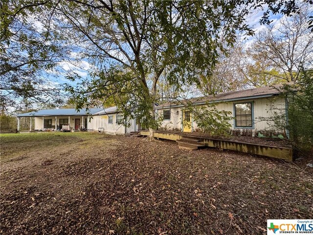 21 Anderson Ln, Coldspring, TX 77331 - back of property featuring covered porch