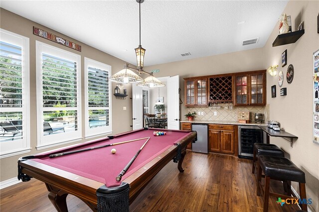 19530 Creekview Oaks, San Antonio, TX 78266 - game room with beverage cooler, bar with sink, pool table, dark wood-style flooring, and a textured ceiling