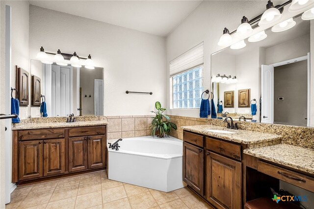 19530 Creekview Oaks, San Antonio, TX 78266 - full bathroom with tile patterned floors, two vanities, and a garden tub