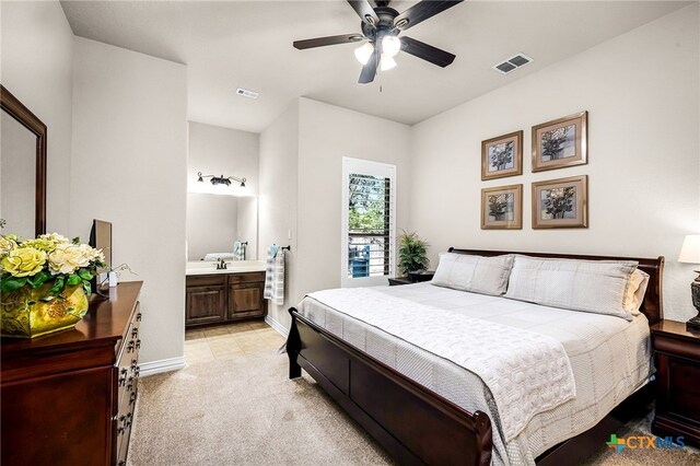 19530 Creekview Oaks, San Antonio, TX 78266 - bedroom with light carpet, ensuite bathroom, and a ceiling fan