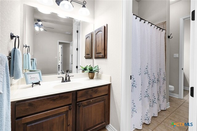 19530 Creekview Oaks, San Antonio, TX 78266 - bathroom featuring vanity, tile patterned floors, ceiling fan, and curtained shower