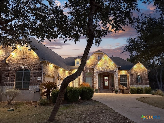 19530 Creekview Oaks, San Antonio, TX 78266 - french provincial home featuring driveway, stone siding, brick siding, and a garage