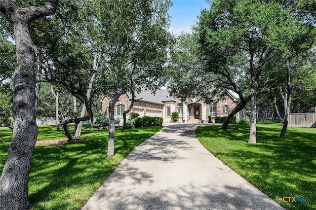 19530 Creekview Oaks, San Antonio, TX 78266 - obstructed view of property with a front lawn and concrete driveway