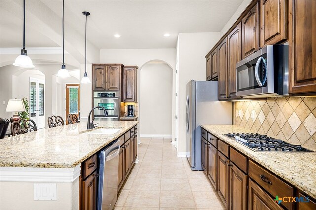 19530 Creekview Oaks, San Antonio, TX 78266 - kitchen featuring stainless steel appliances, arched walkways, tasteful backsplash, light stone counters, and recessed lighting