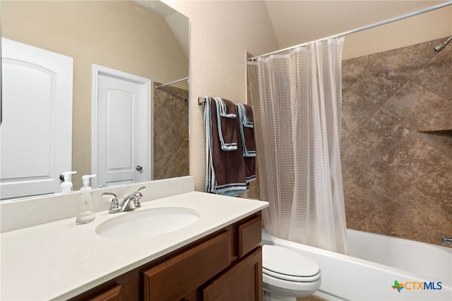 full bathroom with vanity, shower / bath combination with curtain, and toilet