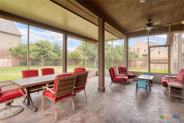 sunroom / solarium with ceiling fan