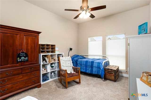 bedroom with ceiling fan and light carpet