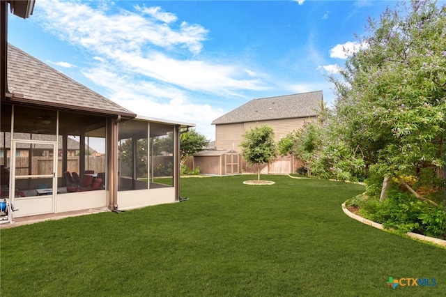 view of yard with a sunroom