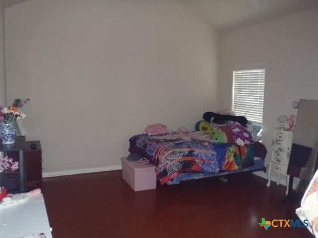 bedroom featuring lofted ceiling