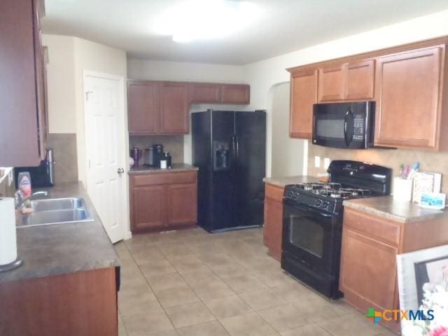 kitchen featuring black appliances and sink