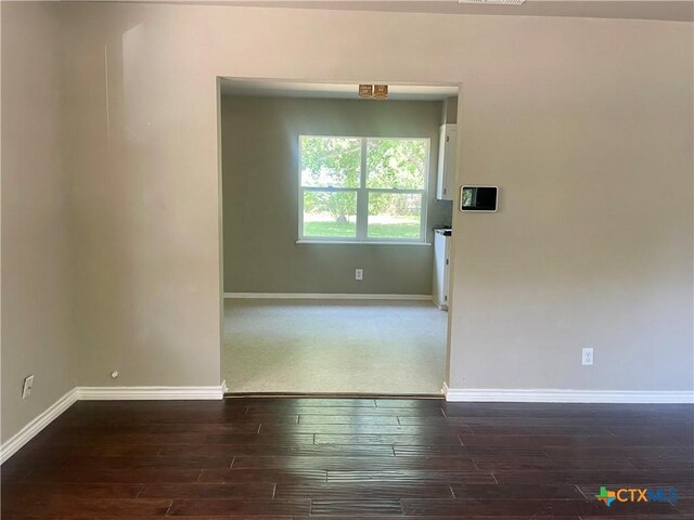 413 Vickers Ave, Seguin, TX 78155 - unfurnished room featuring wood finished floors and baseboards