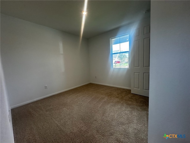 view of carpeted spare room