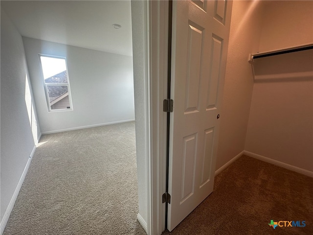 corridor featuring carpet flooring