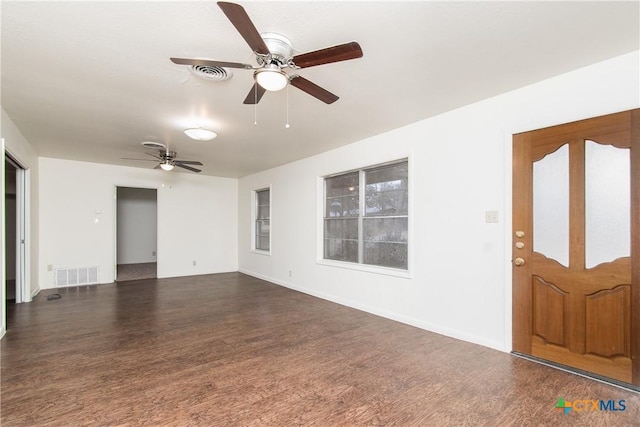 interior space with ceiling fan and dark hardwood / wood-style floors