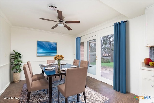 dining area with ceiling fan, french doors, dark hardwood / wood-style floors, and ornamental molding