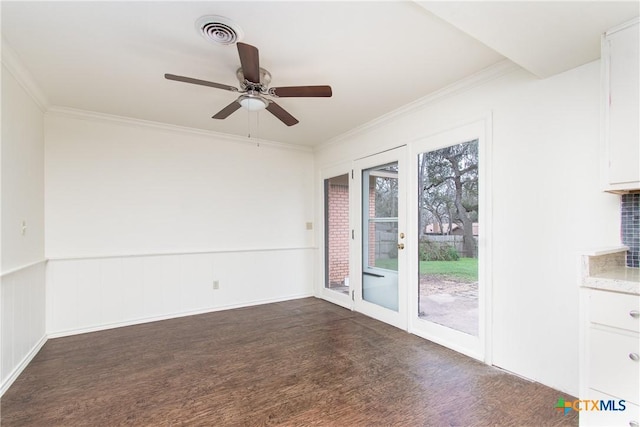 unfurnished room with ceiling fan, ornamental molding, and dark hardwood / wood-style floors