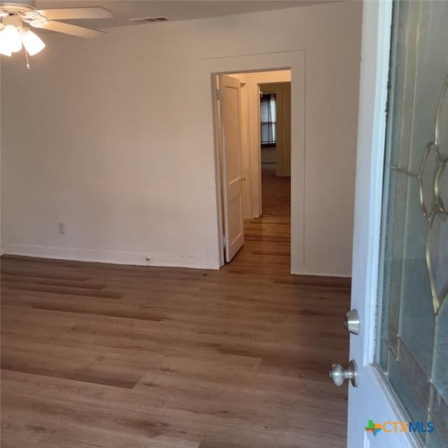 unfurnished room featuring ceiling fan and light wood-type flooring