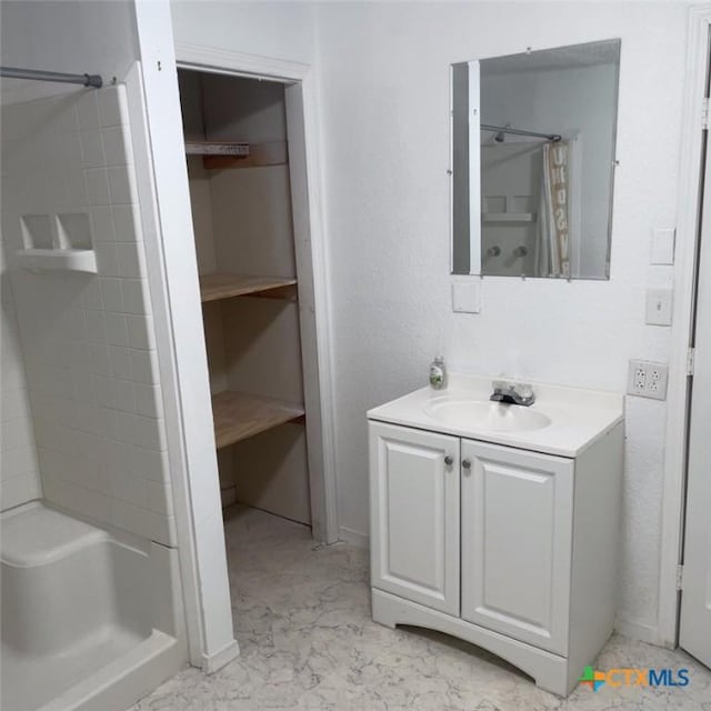 bathroom with vanity and curtained shower