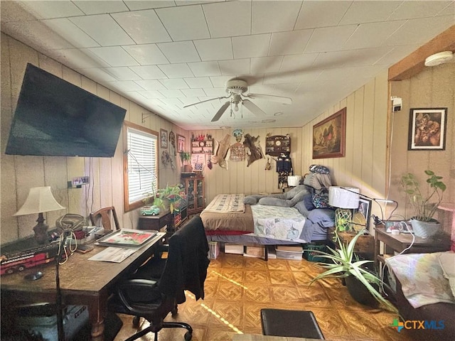 1208 W Adams St, Port Oconnor, TX 77982 - bedroom with wooden walls and a ceiling fan