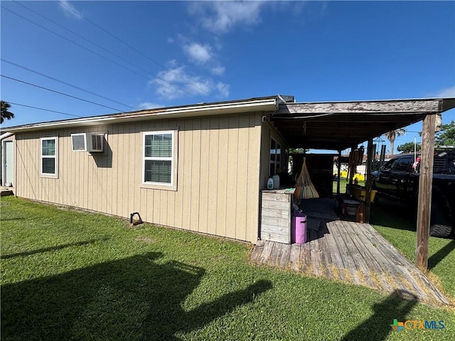 1208 W Adams St, Port Oconnor, TX 77982 - view of side of property featuring a yard and an AC wall unit