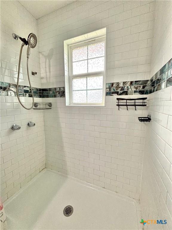 1208 W Adams St, Port Oconnor, TX 77982 - full bathroom with a tile shower