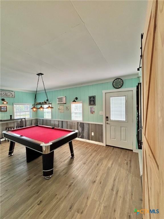 1208 W Adams St, Port Oconnor, TX 77982 - playroom featuring wood finished floors, a wall unit AC, and pool table