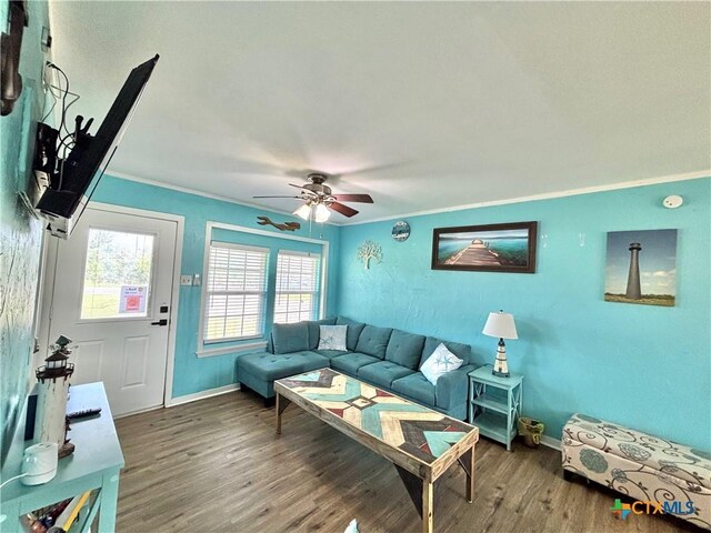 1208 W Adams St, Port Oconnor, TX 77982 - living area with ornamental molding, wood finished floors, and ceiling fan