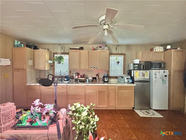 1208 W Adams St, Port Oconnor, TX 77982 - kitchen featuring appliances with stainless steel finishes, a ceiling fan, light brown cabinets, and light countertops