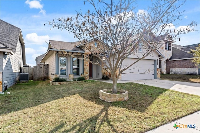 view of front of property with central AC unit, a front yard, and a garage