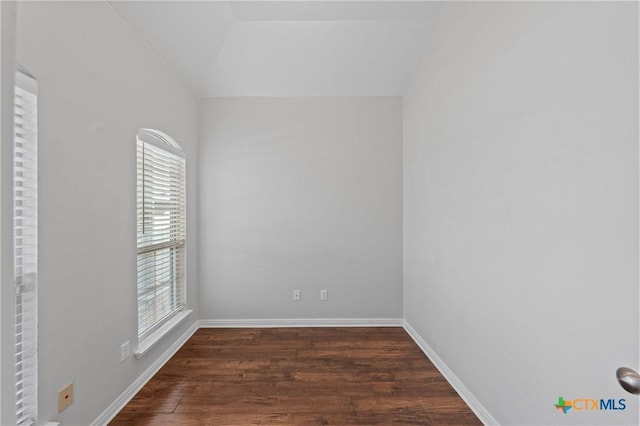 spare room featuring dark hardwood / wood-style flooring