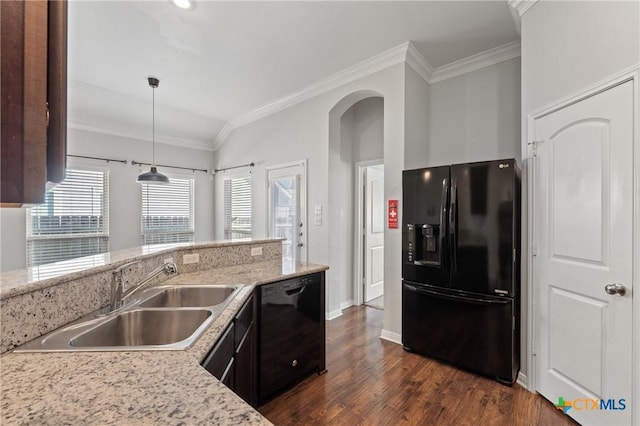 kitchen with sink, dark hardwood / wood-style floors, lofted ceiling, decorative light fixtures, and black appliances