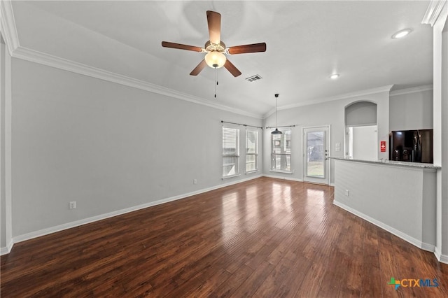 unfurnished living room featuring dark hardwood / wood-style floors, ceiling fan, and crown molding