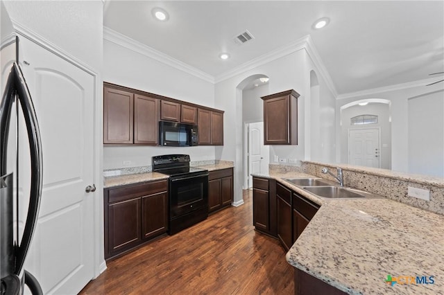 kitchen featuring black appliances, crown molding, sink, dark hardwood / wood-style floors, and light stone countertops