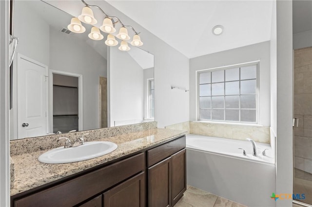 bathroom with tile patterned flooring, vaulted ceiling, and independent shower and bath