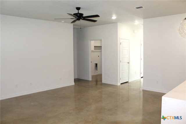 empty room featuring concrete flooring and ceiling fan