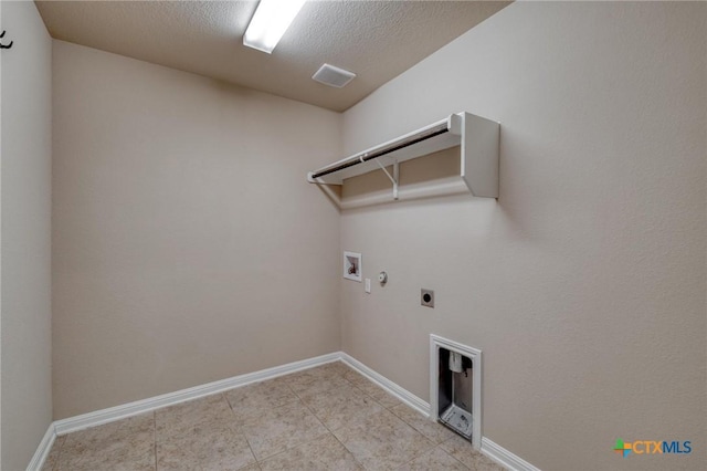 7400 Longford Trl, Austin, TX 78754 - washroom with hookup for an electric dryer, gas dryer hookup, washer hookup, a textured ceiling, and light tile patterned floors