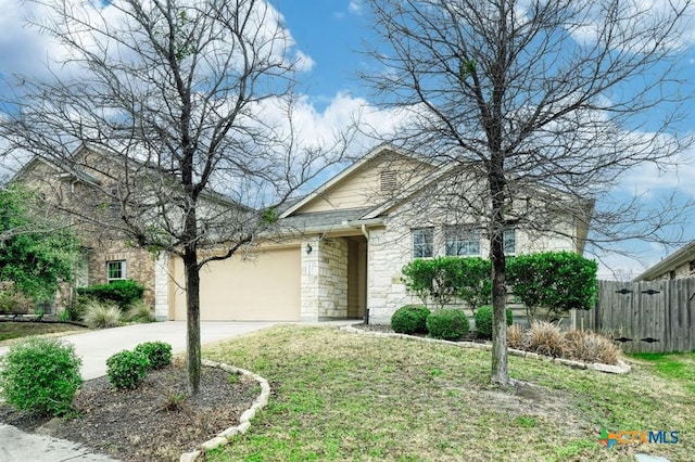 7400 Longford Trl, Austin, TX 78754 - view of front facade featuring stone siding, concrete driveway, and a garage