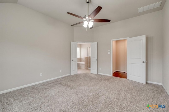 7400 Longford Trl, Austin, TX 78754 - unfurnished bedroom with carpet, lofted ceiling, and ensuite bathroom