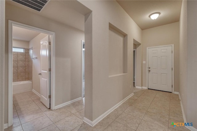 7400 Longford Trl, Austin, TX 78754 - corridor featuring light tile patterned flooring