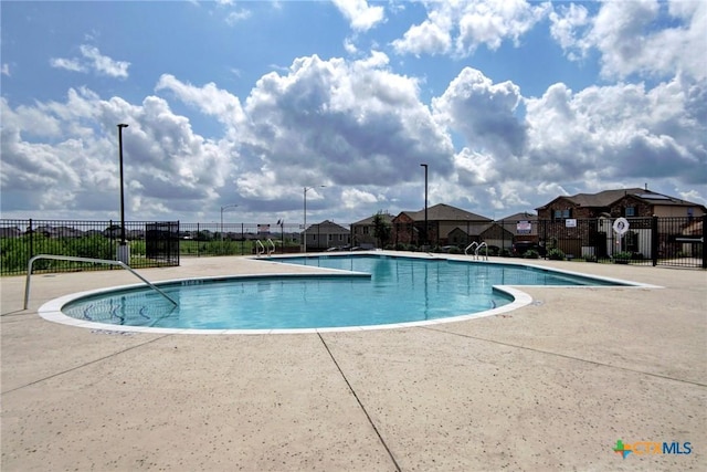 7400 Longford Trl, Austin, TX 78754 - community pool featuring a patio and a residential view