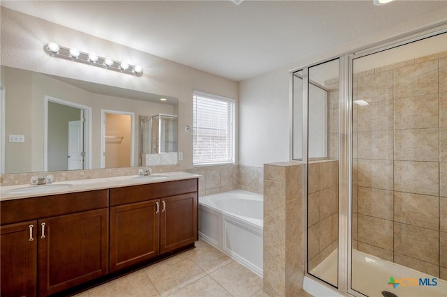 7400 Longford Trl, Austin, TX 78754 - full bathroom featuring a shower stall, double vanity, a bath, and tile patterned flooring