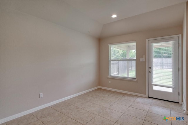 7400 Longford Trl, Austin, TX 78754 - doorway with light tile patterned flooring, lofted ceiling, and recessed lighting