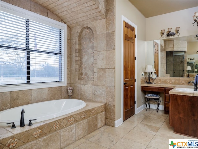 bathroom with vanity and separate shower and tub