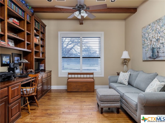 office area featuring ceiling fan, beam ceiling, built in desk, and light hardwood / wood-style floors