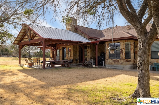 exterior space featuring a yard and a patio area