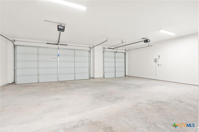 garage featuring a garage door opener