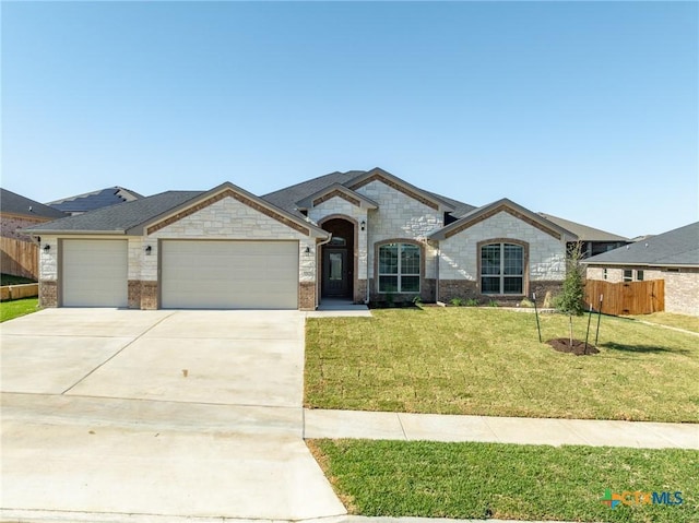 view of front facade with a front lawn and a garage