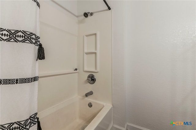 bathroom featuring washtub / shower combination