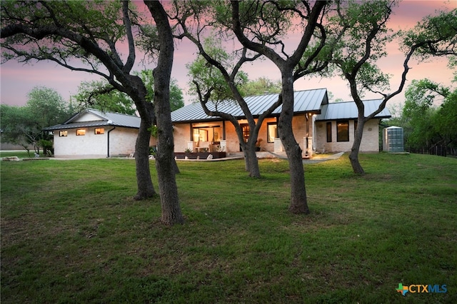 1910 S Rainbow Ranch Rd, Wimberley, TX 78676 - view of front of property with a standing seam roof, metal roof, and a yard